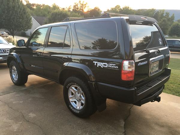 Bedliner spray on previously rusting chrome bumper, trim/vinyl black spray on plastic trim that snaps into top of bumper. Looks awesome.