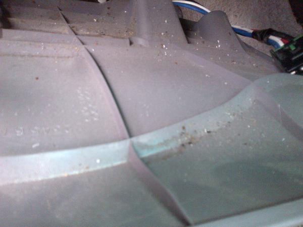 Behind the knee trim panel...ashes and nastiness.