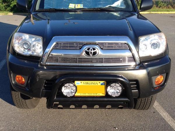 Billet grille, amber fog light film, bull bar, and new KC fog lights.