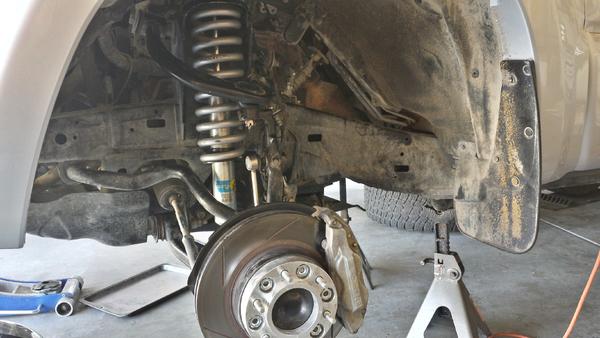Bilstein 5100, Eibach 620lb spring, Power Slot slotted rotor, Hawk HPS brake pads, and 1 1/4 wheel spacer.