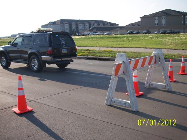 Blocking a road after heat expansion cracked the concrete.