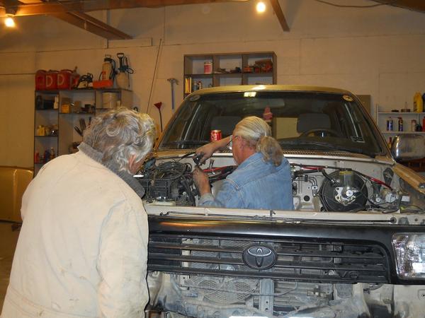Bro and a friend helping out.  We had to remove the wheels and drop the truck onto blocks for better access.