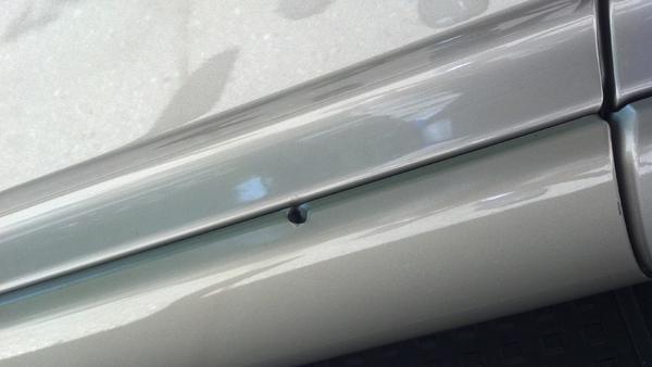 Bullet hole drivers side front door
