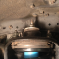 bushings nested on each other and assembled on top of strut and installed on truck