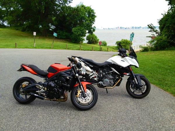 Can not wait for warmer weather! The boy's toy (KTM 990 SMT) and my Triumph Street Triple R