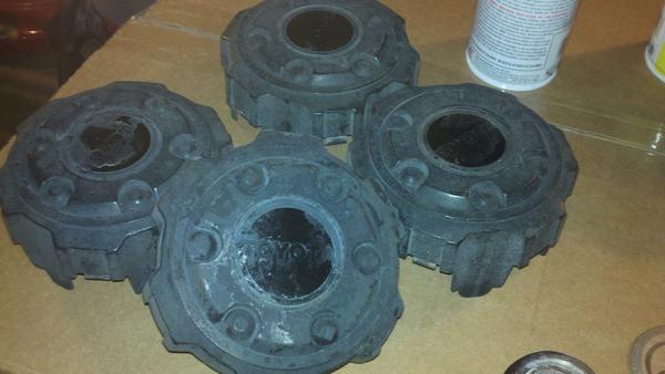 Center caps before. Removed the adhesive toyota logos to reveal the embedded Toyota emblem. I then applied plasti-dip.