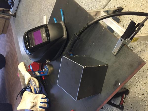 Center console lock box tack welded