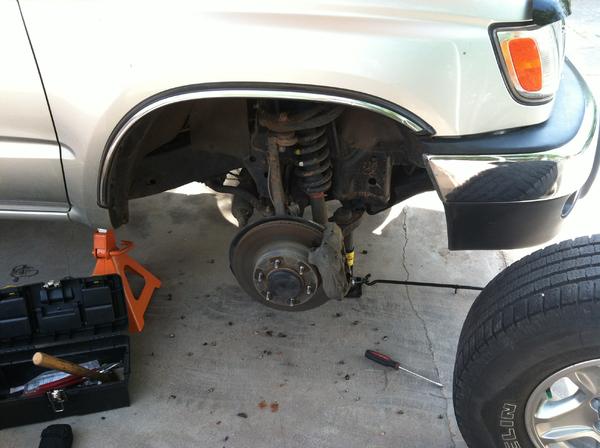 Changing out the front struts with some coilovers.