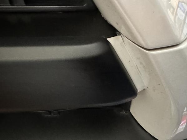 Close up of Plasti Dip on top piece behind cap overlay on front grill
