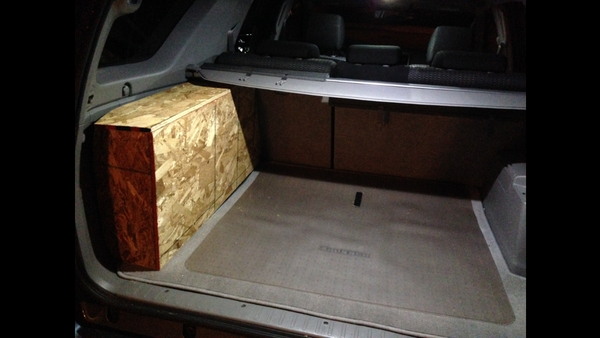 Close-up of plywood cargo organizer before being covered in carpeting.