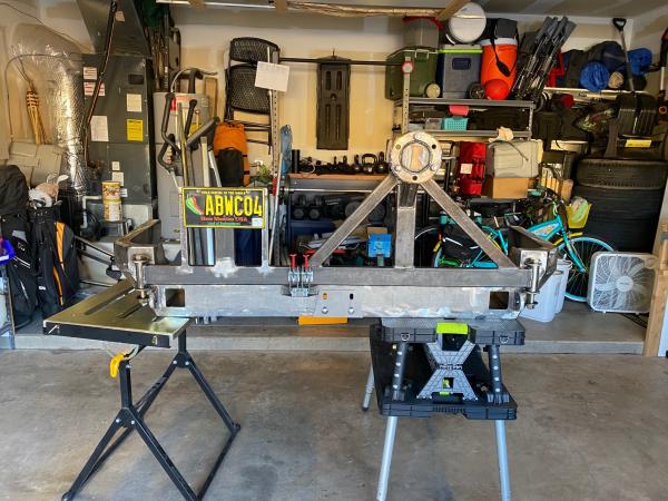 Coastal Offroad rear bumper with custom made swingarms. Swingarms completed. Used an old Rotor for the tire mount.