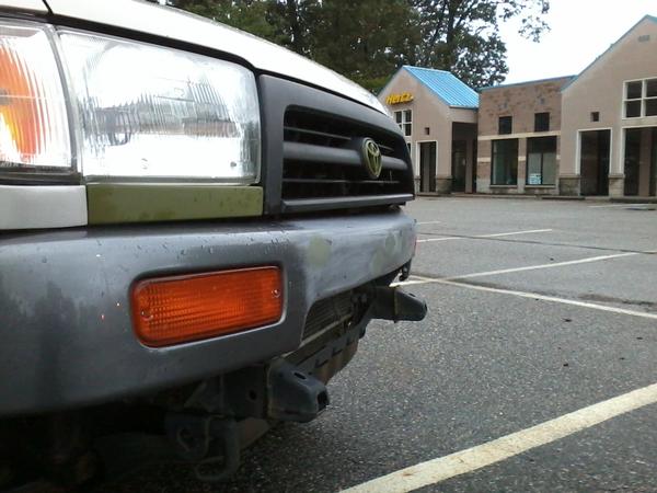 comparing bumper with alignment of headlights.