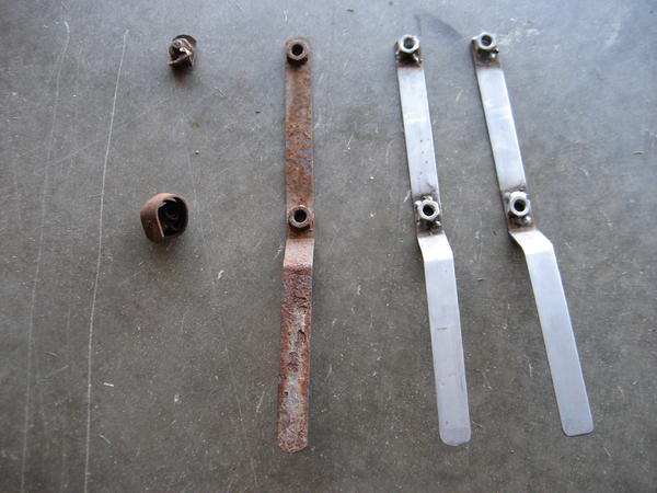 Curled bracket & new welded ones.