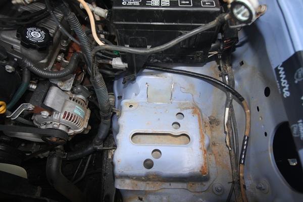 cut battery clamp bracket, cut fuse box mount, both plastic and metal