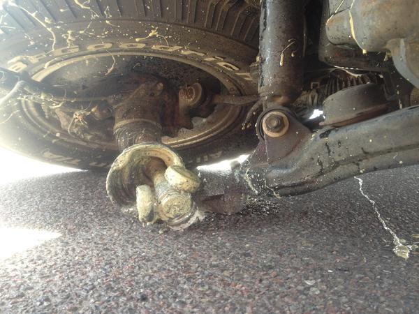 CV Axel juice everywhere, Body mount bolt sliced the sidewall.