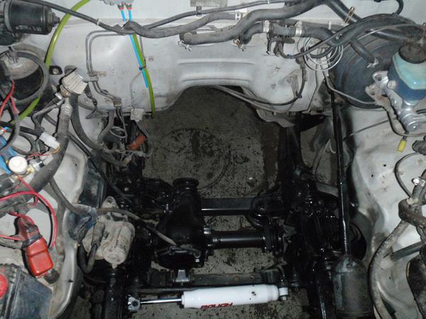 Decided to tackle the engine. Nothing wrong with the old one, just underpowered for all the extra weight I was putting on the truck. Repainted the fra