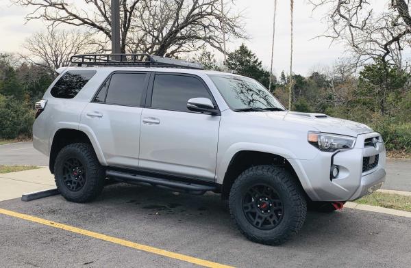Done a few simple mods to change the stock look.  

- Running boards
- Wheels and tires
- Roof rack
- Tint
- Shackles
- Debadged
- Hood scoop black de