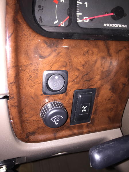 Drilled 3/4" hole above the dash light level knob.  Pushed the switch on through, and tightened it down on the back.