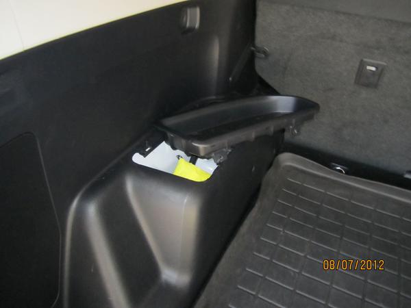 Driver side storage mod. Took about 30 seconds once I figured the "brute force" required