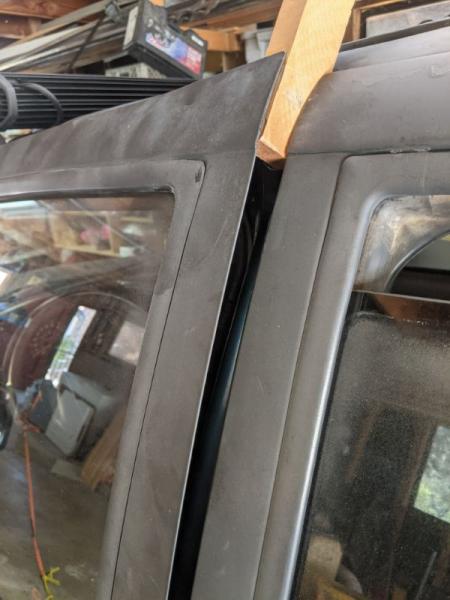 Driver's side door was bent and wouldn't open without some serious upward force.
