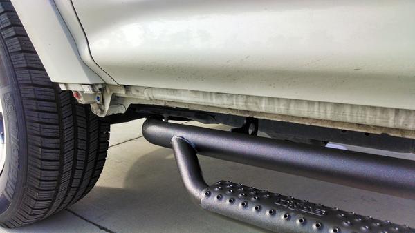 Driver's Side front quarter - close up of nFab bars w/o OEM skirts