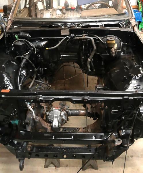 Engine bay mostly gutted, cleaned, and painted gloss black.  Frame and suspension components will be satin black.