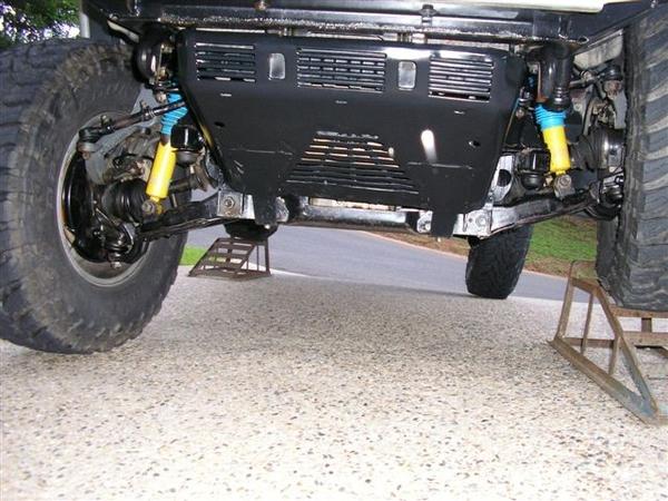 Even with simple inspection ramps the IFS flexes well. The standard jack has to go under the control arm otherwise the tyre won't lift off the ground.