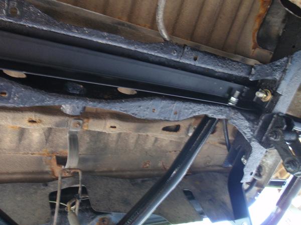 fabricated a piece of angle iron to give the old rusty tire carrier crossmember some support.