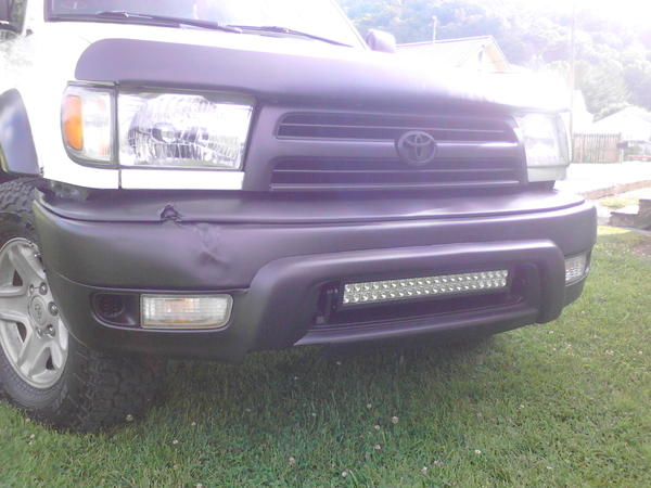 Factory Toyota grill Plasti dipped black. Bug guard Plasti dipped black due to fading and looking like hell.