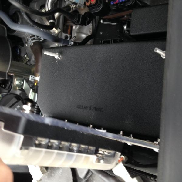 Fasteners mounted to factory cover