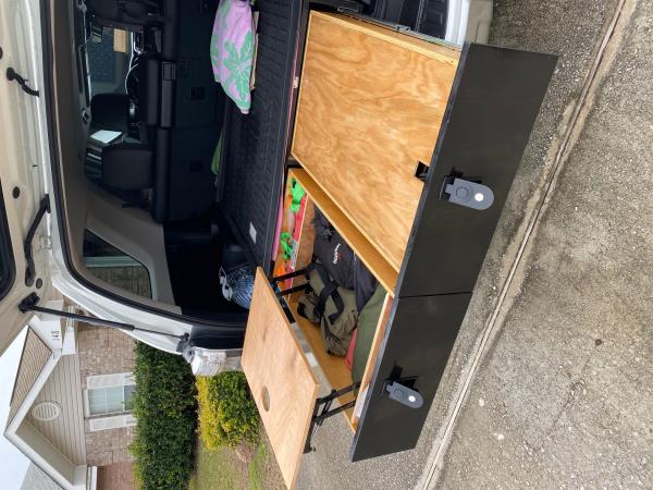 final product. coffee table has a cut out for a tumbler and workspace. The right drawer has a simple cover to serve as a table / makeshift changing st