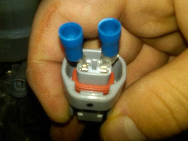 Fit both of the trimmed connectors into the contact points in the adaptor