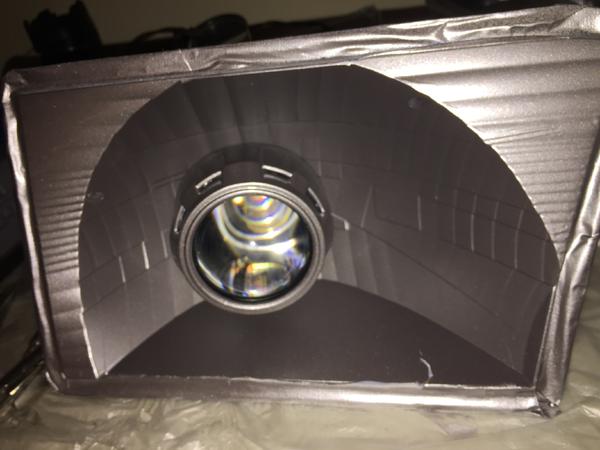 Fitting the projector to the housing.