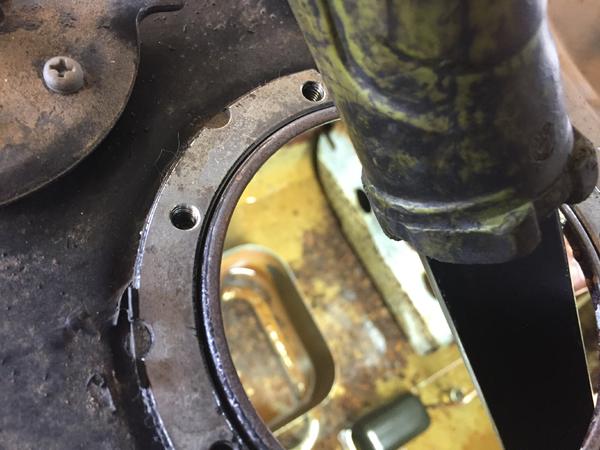 Flashlight looking into the tank showing the rust.