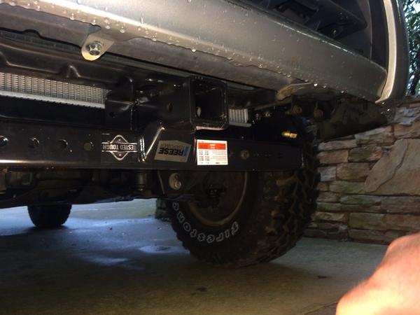 Front hitch install.  Reese universal hitch for winch cradle.  Better than nothing:)  Cannot afford new plate bumper!