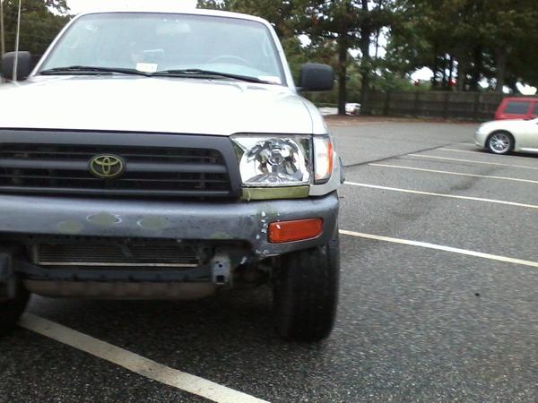 Front left (drivers' side) bumper dented inward.