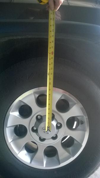 Front wheel well spacing - pre-lift