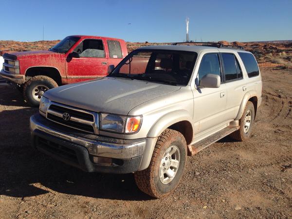 Getting dirty in the mud out at work. My friend kory's truck in the background