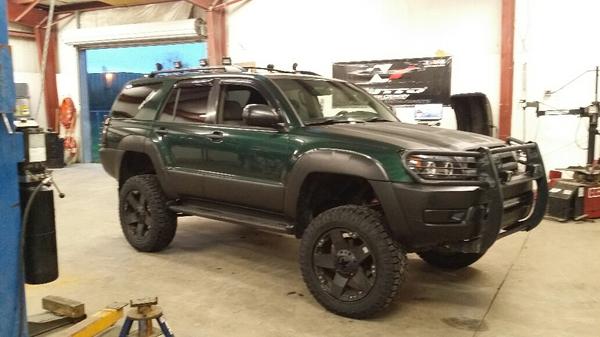 Getting her new shoes on.