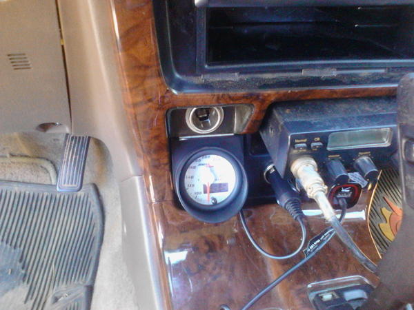Glowshift Max Tow Trans temp gauge installed in use-less cubby hole. Actually fits perfect. Drill couple small holes in back of cubby hole for wire to