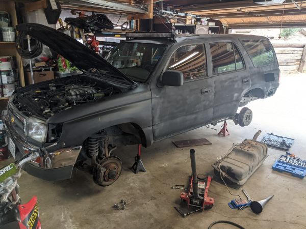 Got the tank dropped. It was a balancing act as I don't have a transmission hoist, just a floor jack, and the tank was over halfway full. Also also, I