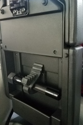 Heavy duty velcro mounted small Maglite in center console.
