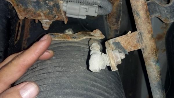 Height adjuster bracket is rusted away and broken.