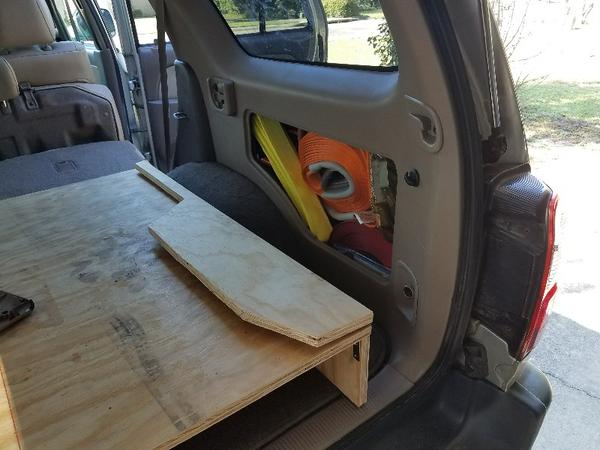 Hinged wing for side storage access