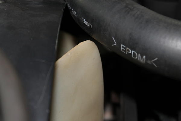 How much clearance I used to have between rad. hose and fan blade.