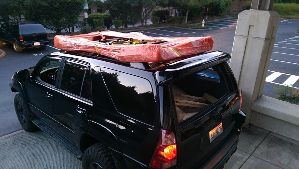 I broke down the box at the UPS freight pickup location and strapped it to the stock roof rack