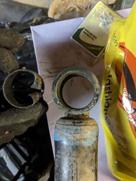 I don't own a press. After much effort, I was finally able to remove the old bushing. I used a c-clamp to press out the inner metal ring, a drill pres