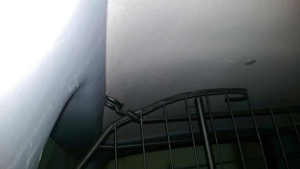 I installed factory d rings in the roof to attach and secure the top part of the barrier.