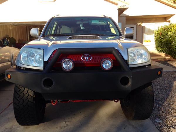 I made a custom grill from a honeycomb patter piece of steel , also moved my fogs and ordered a set of 4" led flood lights for the bumper.