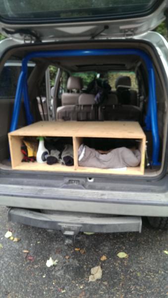 ignore the clutter and half finished storage/sleeper… 1st gen roll bar is in!
